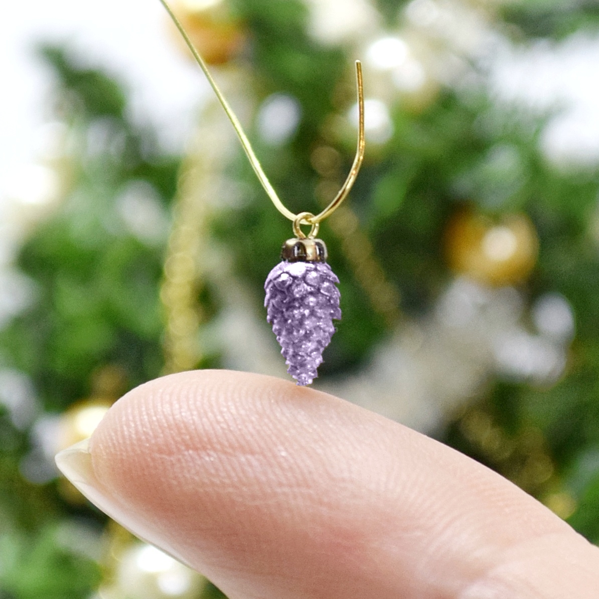 Xmas ornament. Painted. Pine cone purple.