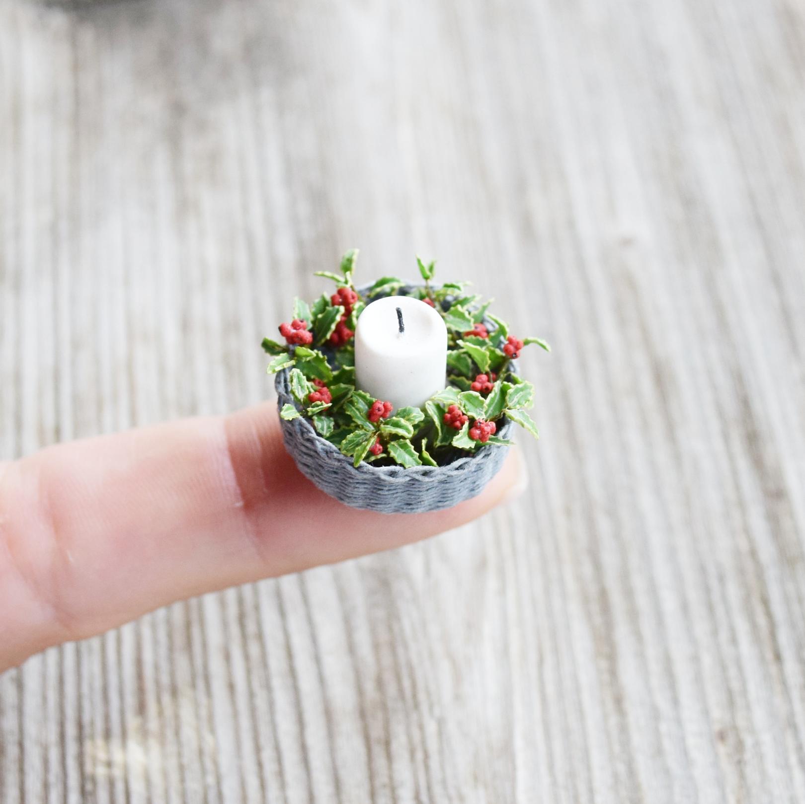 Holly plant decor. Basket with candle.