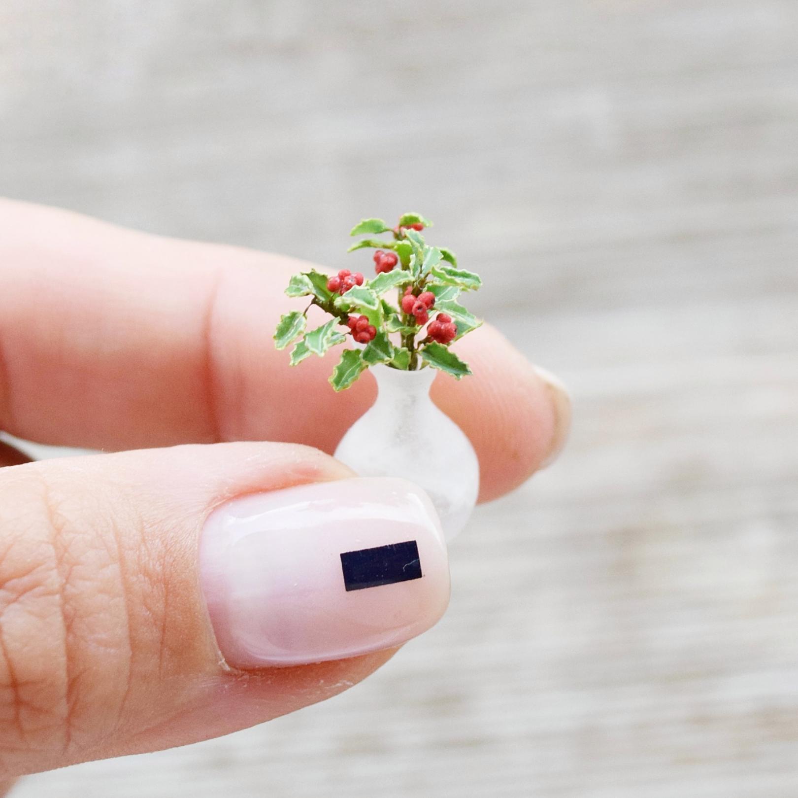 Holly plant decor. Bouquet in the vase.