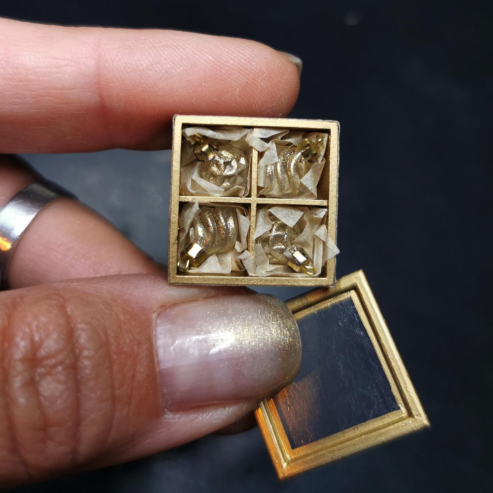 Christmas ornaments set in the box. Milky transparent with antique gold 4 drops.